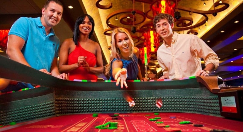 Photo of people playing the best online casino games craps