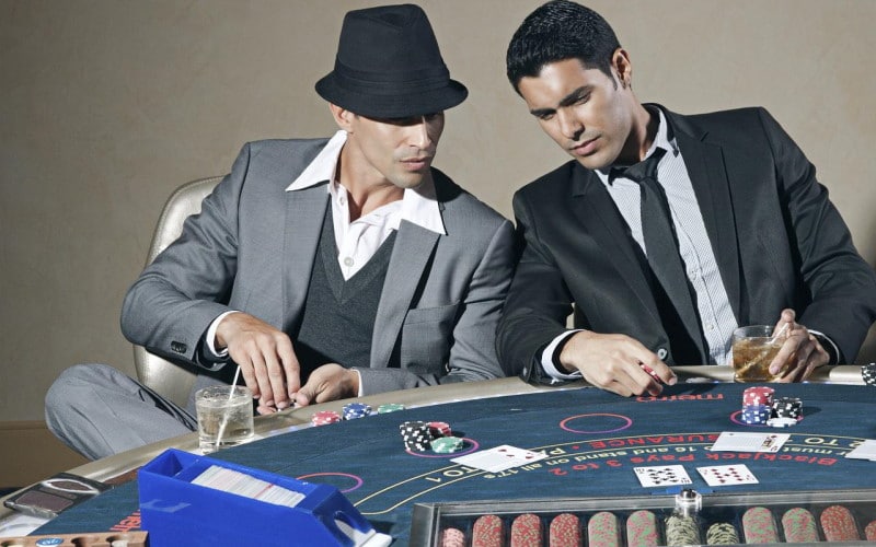 Image of two people playing blackjack
